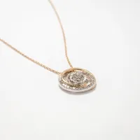 Diamond Swirl Necklace in 10K Yellow and White Gold (0.25 ct tw)