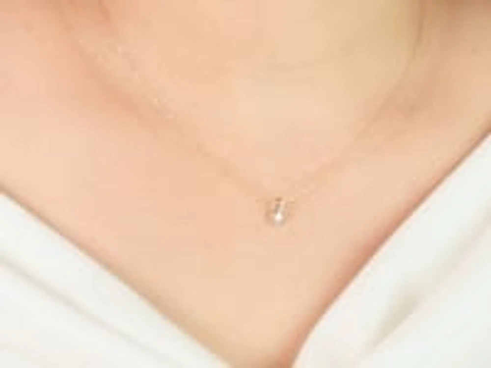 Tension Set Canadian Diamond Solitaire Necklace in 14K Yellow Gold (0.