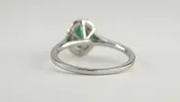 Oval Emerald and Diamond Halo Ring 10K White Gold (0.12 ct tw)