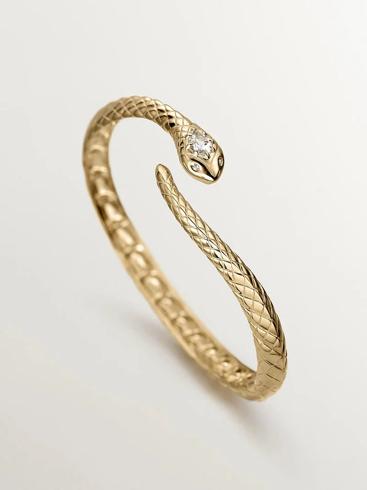 Brazalete rígido serpiente de plata bañada en oro amarillo de 18kt con piedras topacio y zafiros blancos