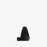 Embossed Check Buckled Messenger Bag​ in Black - Men, Leather | Burberry® Official