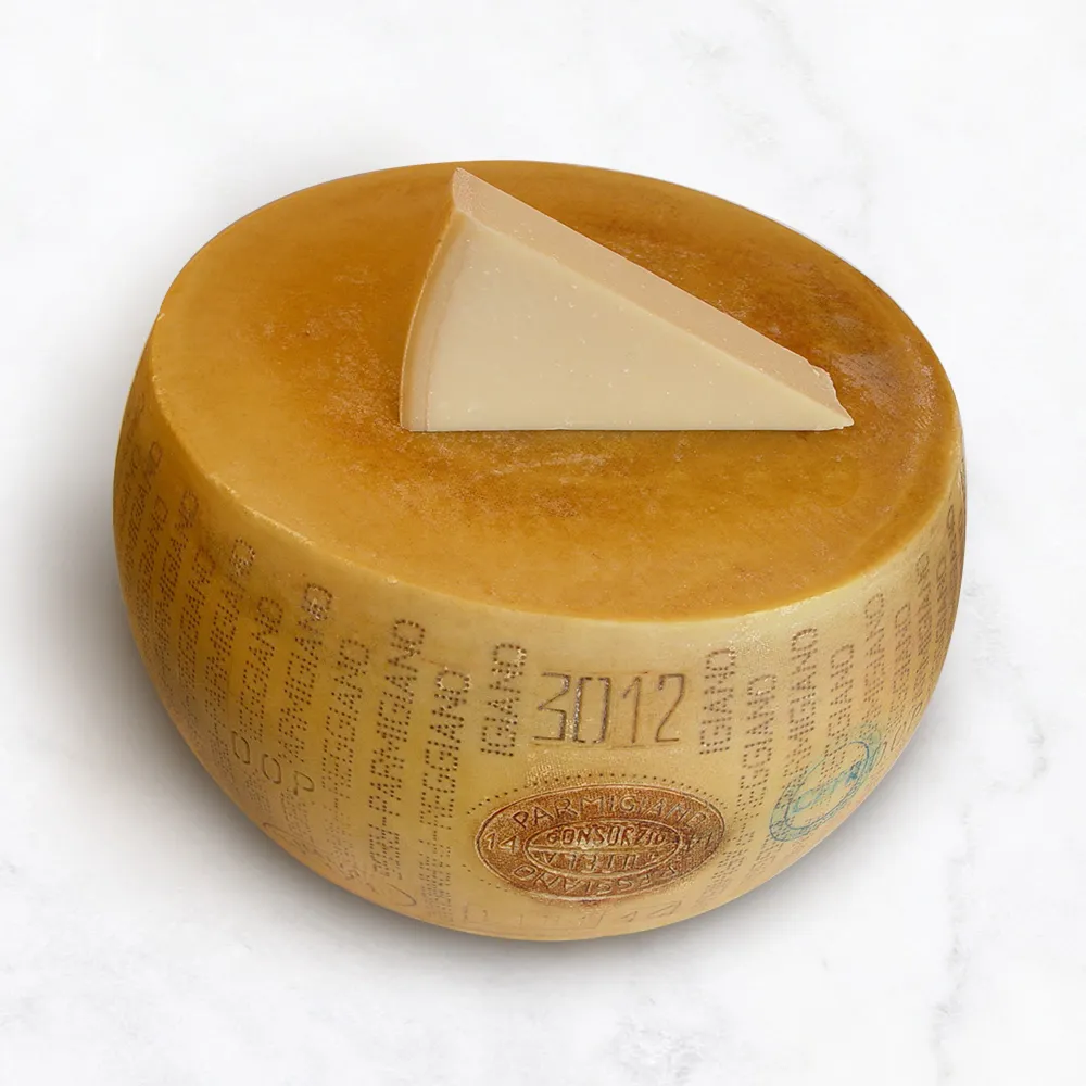 opening a wheel of parmesan cheese (parmigiano reggiano) 