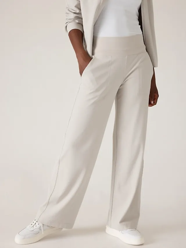 Buy Athleta Cream Endless Mid Rise Taper Trousers from Next Netherlands