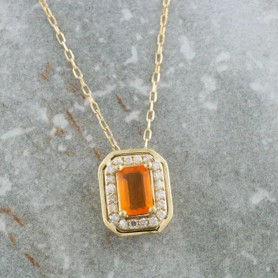 American Colors Emerald Cut Fire Opal & 1/8 ct. tw. Diamond Halo Pendant in 10K Yellow Gold