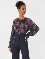 Blusa Floral con Plisado Radial