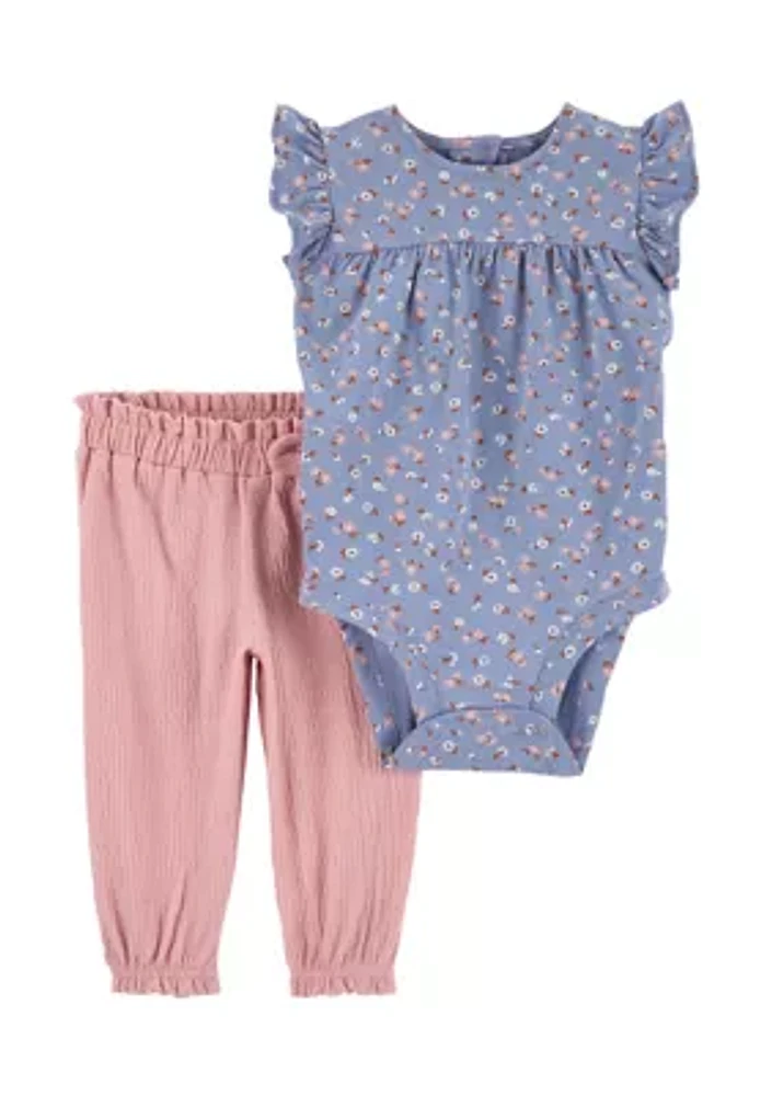 Made to match, this set is complete with a floral bodysuit and pair of easy on pants.