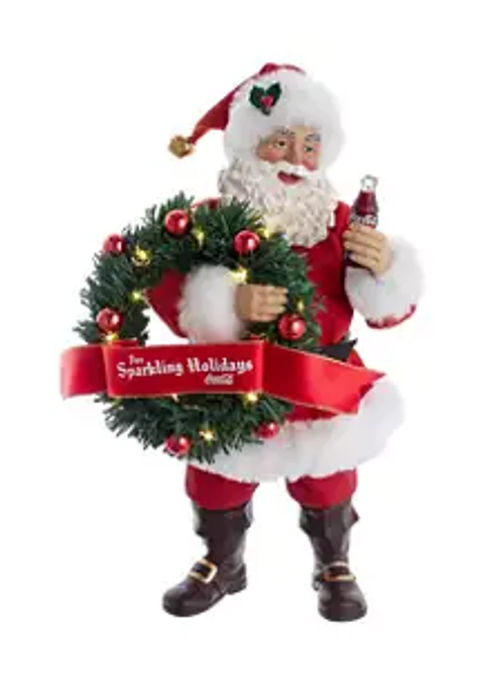 Coca-Cola 10.5-Inch Fabriché™ Coca-Cola® Battery Operated Santa With Lighted Wreath