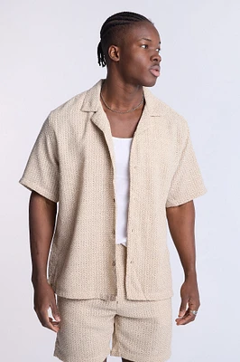 Haut en tricot texturé à manches courtes géometrique