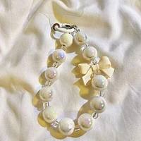 Vogue Strap: Marble Bead Bow Charm Bracelet Phone Accessory (Color Ships Assorted)