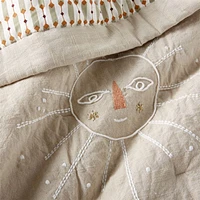Gwen Embroidered Organic Cotton Baby Crib Quilt by Jeremiah Brent