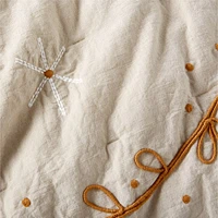 Gwen Embroidered Organic Cotton Baby Crib Quilt by Jeremiah Brent