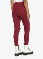 Burgundy Destructed Skinny Jeans