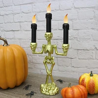 Light-Up Gold Skeleton Plastic Candelabra, 6.3in x 14in