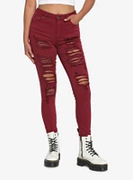 Burgundy Destructed Skinny Jeans