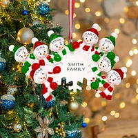 Family of 8 Snowmen around a Snowflake Ornament