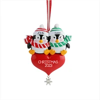 Penguin Sitting on the Heart Ornament