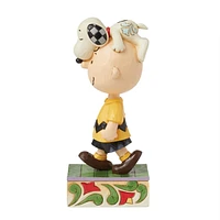 Snoopy on Charlie Brown's Head