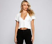 Pleated and Poised Peplum Blouse