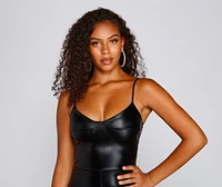 Sleek And Mysterious Faux Leather Catsuit