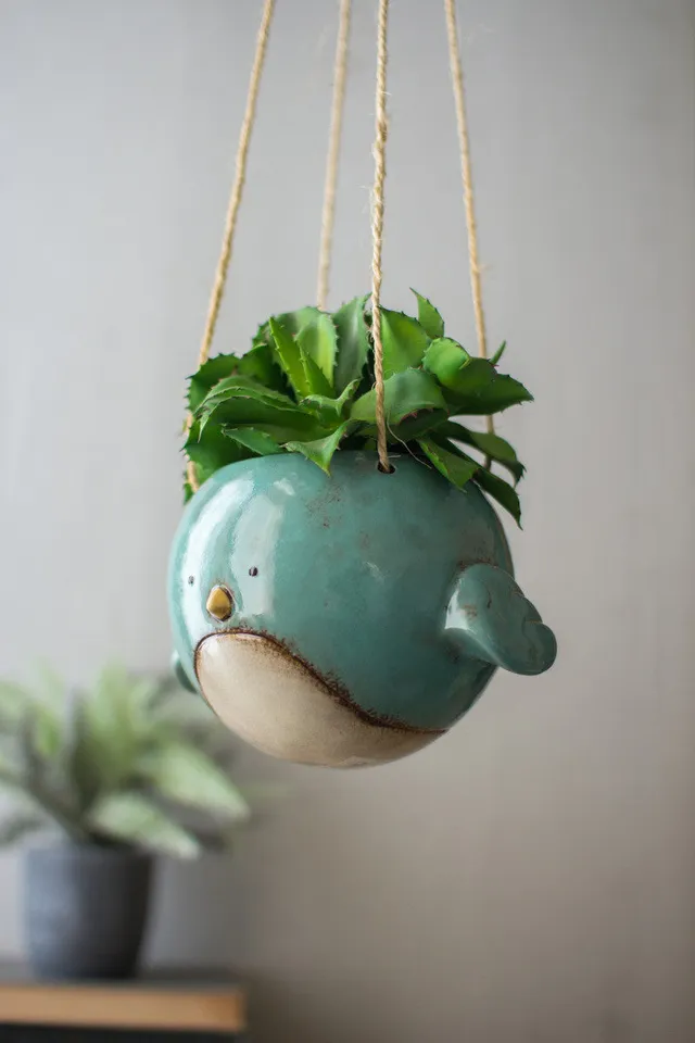 https://cdn.mall.adeptmind.ai/https%3A%2F%2Fcdn.shopify.com%2Fs%2Ffiles%2F1%2F0255%2F5566%2F4968%2Fproducts%2Fceramichangingbirdplanter.jpg_640x.webp