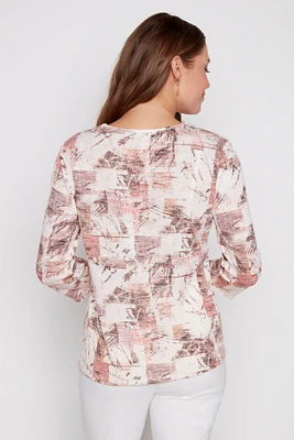 Print top with buckle detail