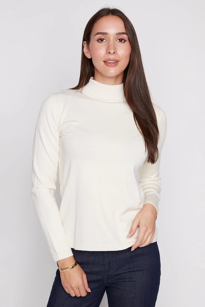 Le pull uni à col montant