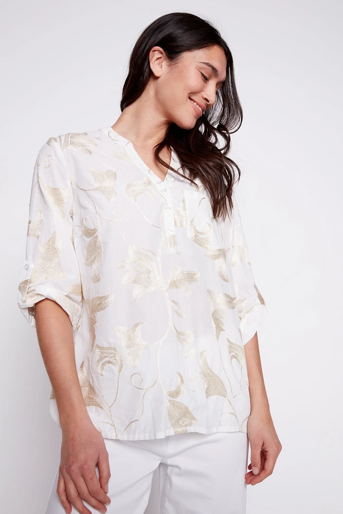 La blouse en coton avec broderies feuilles lurex