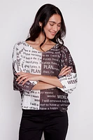 Newspaper print knit sweater