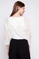 Le pull au crochet à manches cloches