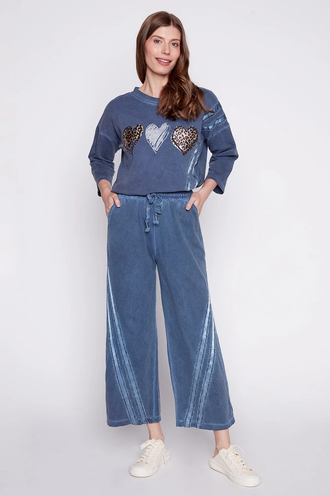 Le pantalon palazzo avec détail ruban