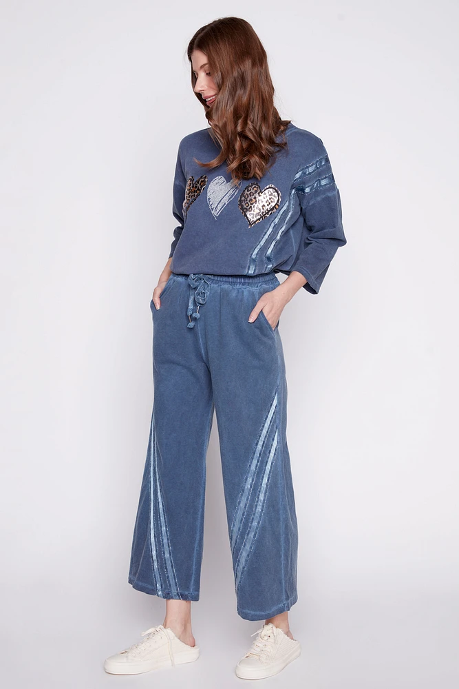 Le pantalon palazzo avec détail ruban