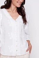 La blouse en coton avec broderie