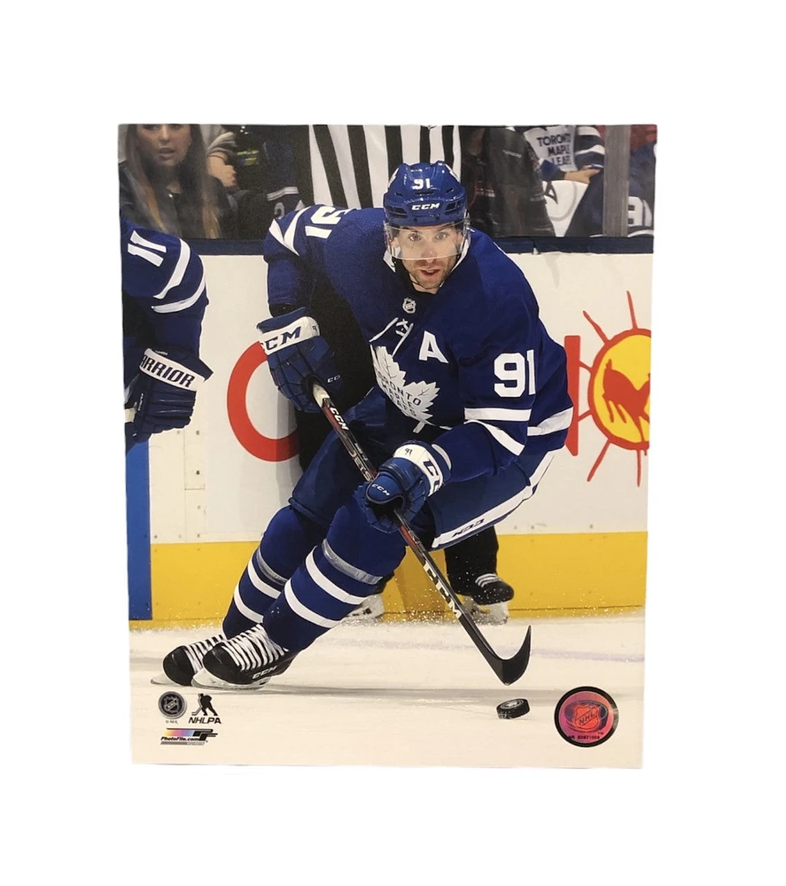 NHL 8x10 Player Photograph Puck John Tavares Maple Leafs