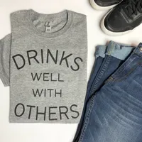 DRINKS WELL WITH OTHERS T-SHIRT