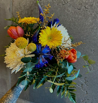 Vibrant bouquet of Gerbera daisies, hyacinths, and tulips