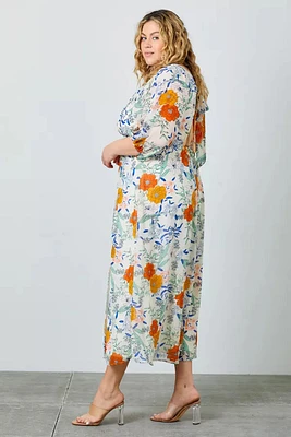 Robe longue fleurie en mousseline nouée au dos