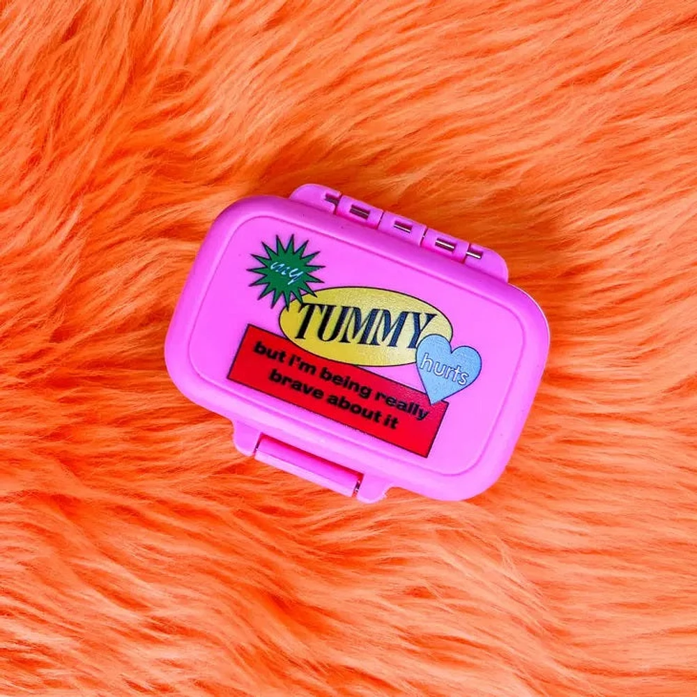 Estuche para pastillas para el dolor de barriga