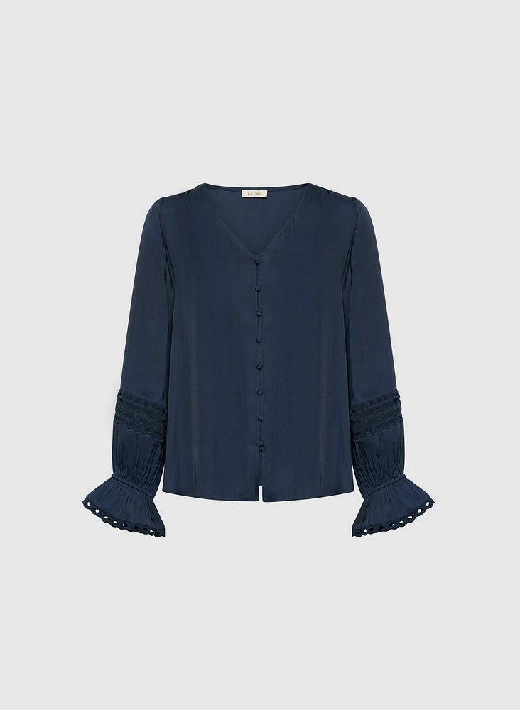 Blouse boutonnée à détails brodés