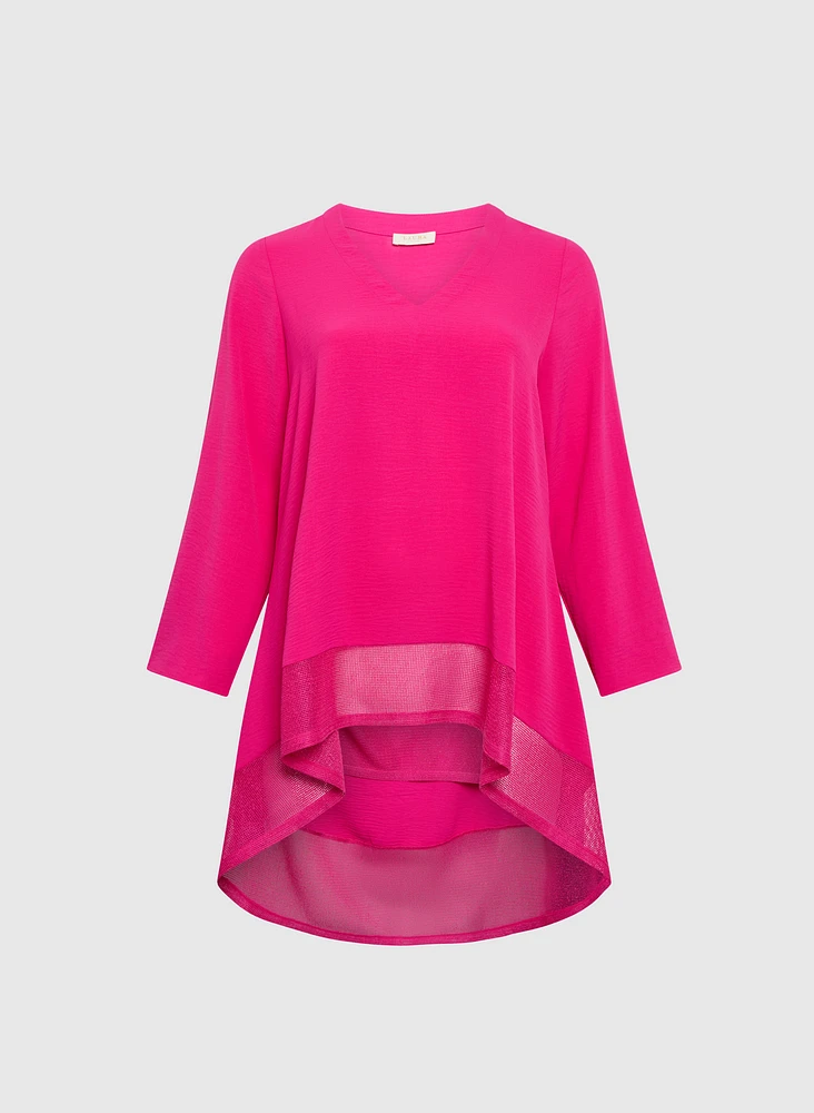 Blouse asymétriques à manches repliées