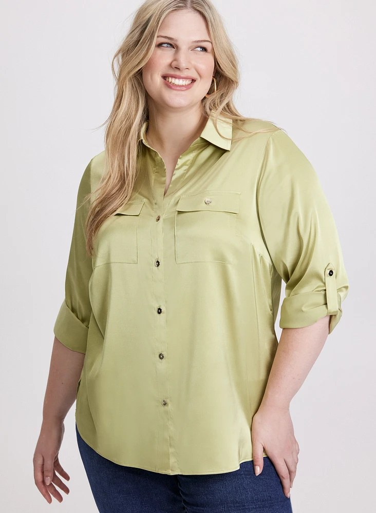 Blouse en satin à poches appliquées