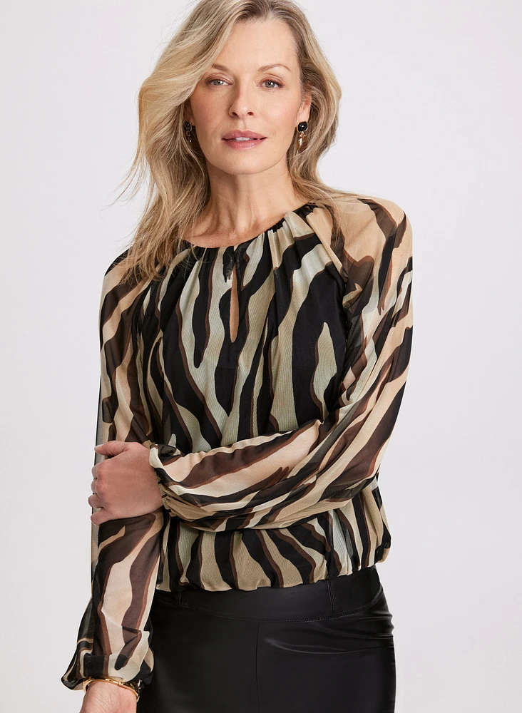 Blouse à manches bouffantes et motif zèbre