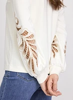 Haut à broderies ajourées