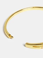 Bracelet jonc à effet croisé et pierres