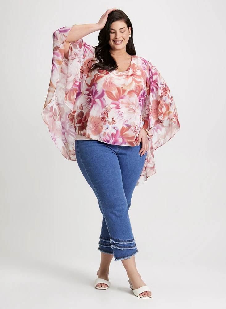 Blouse florale et jean droit à franges