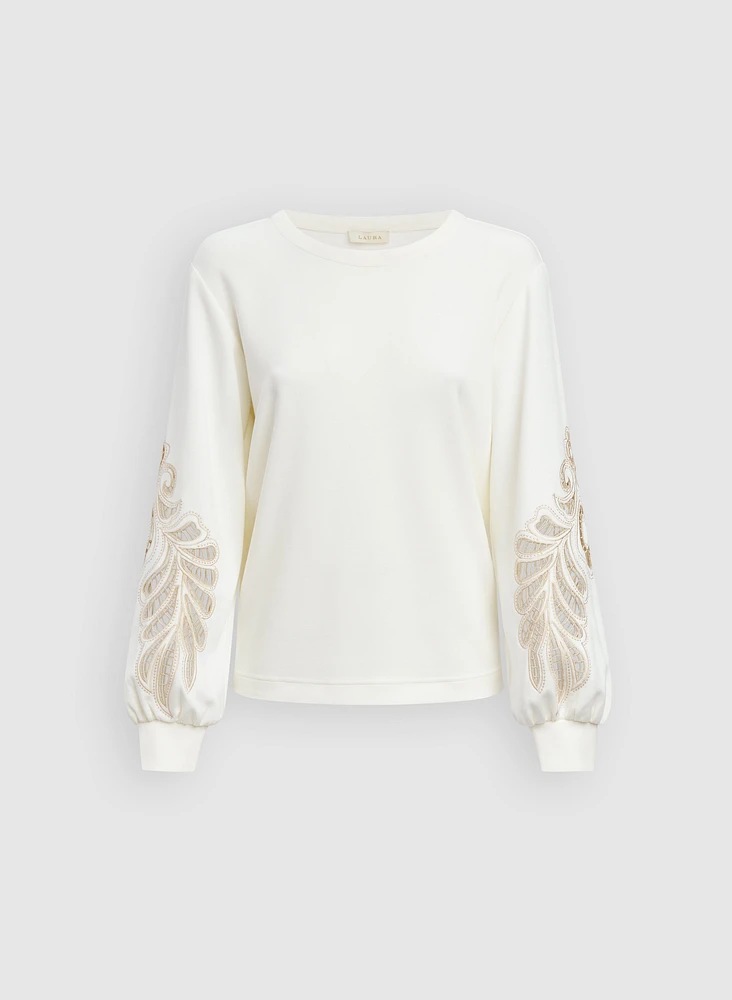 Haut à broderies ajourées