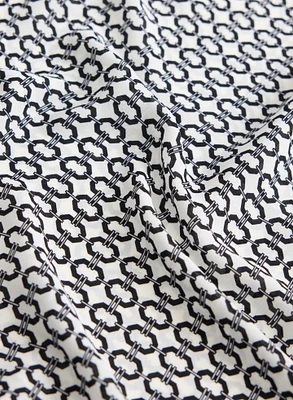 Blouse contrastante à motif géométrique