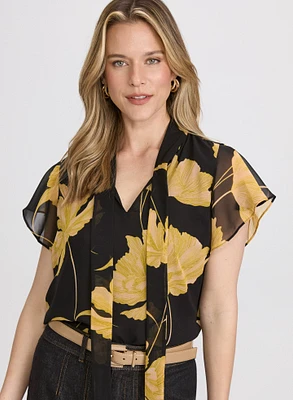 Blouse florale à encolure nouée