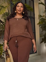 Pull en tricot ajouré