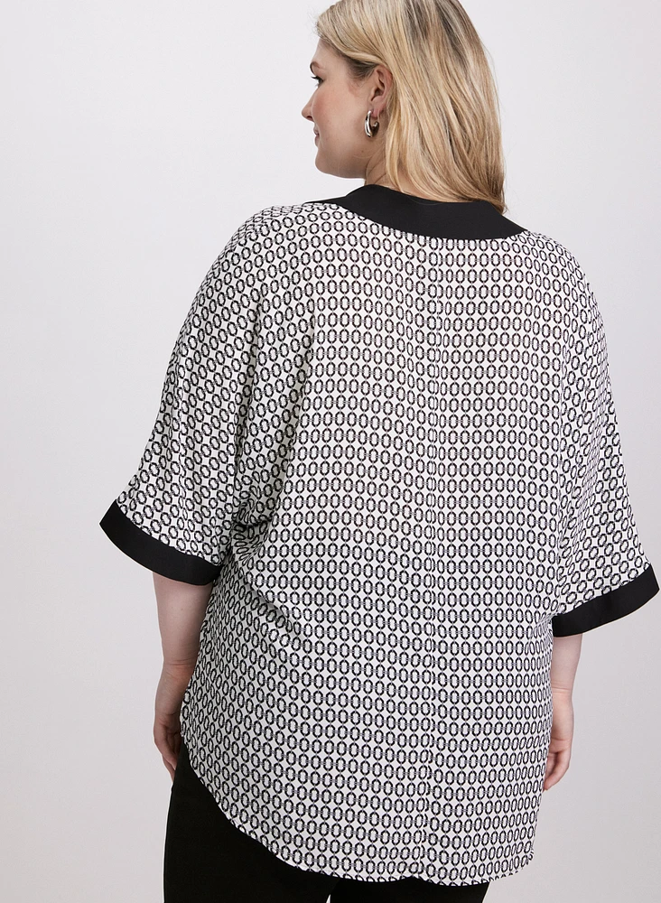 Blouse contrastante à motif géométrique