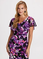 Robe cocktail florale avec volant en chiffon